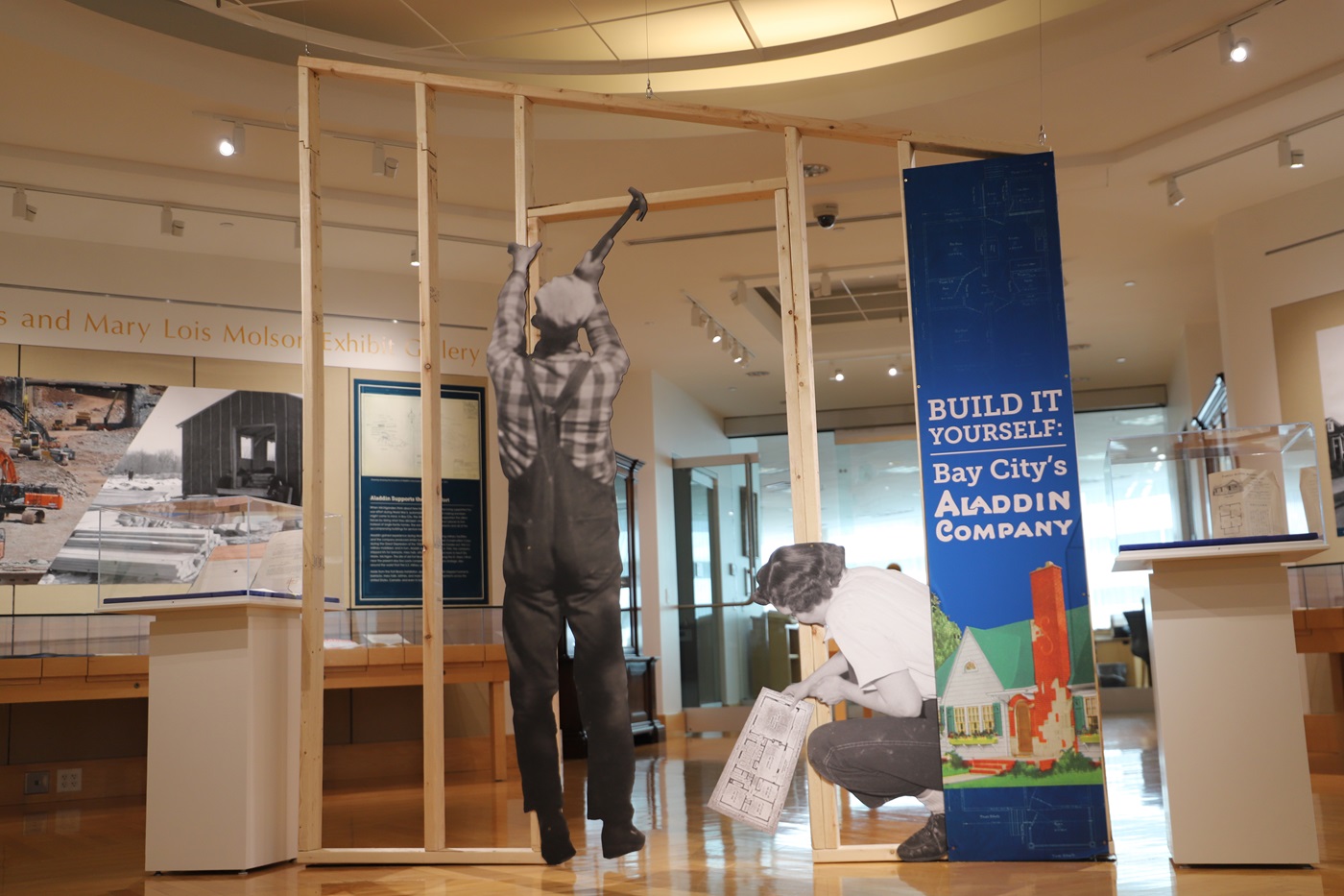 a display of a construction site with a sign that says Build It Yourself: Bay City's Aladdin Company