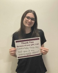 OVheadshot Image_200x250 A woman holding a sign that says, Thank You, Because of your gift I can comfortably finish my last year of my undergraduate degree!