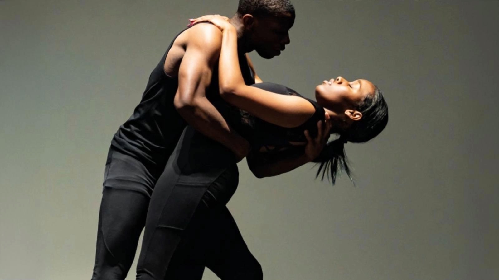 A man and woman dancing, displaying consent practices.
