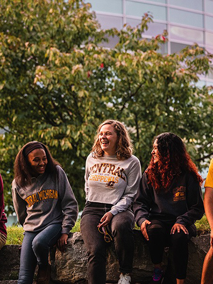 Students sitting in front of Park Library