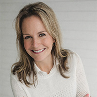 Deborah_Gray_200x200 Deborah Gray smiling in a professional headshot, wearing a light sweater against a neutral background.