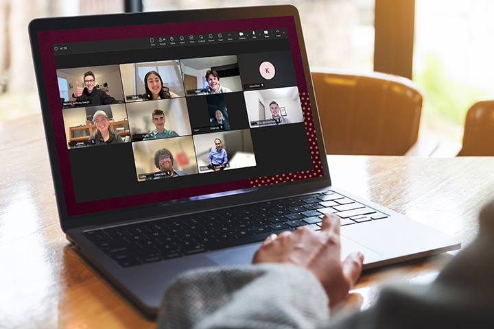 A laptop displaying a Microsoft Teams meeting with Central Michigan University College of Business Administration students, alumni and staff during the Alumni Connect pilot program.