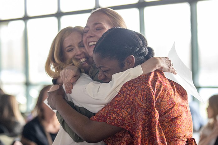 25-03-21 Match Day MH-4 700 x 467 Three female medical students hug, smiling with a small tear, as they celebrate where they Matched for their medical school residencies..