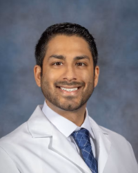a man in a white coat