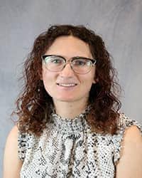 Headshot of Natasa Petreska wearing a white and black tank top.