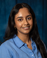 Bhatti, Afifa a woman with long hair wearing a blue shirt