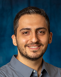 a man smiling for a picture