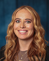 a woman with blonde hair smiling