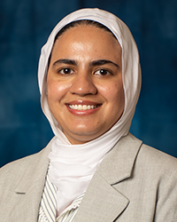 a woman wearing a white scarf