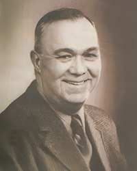 Headshot of James Stanford Bradshaw, a greyscale image cut from a newspaper