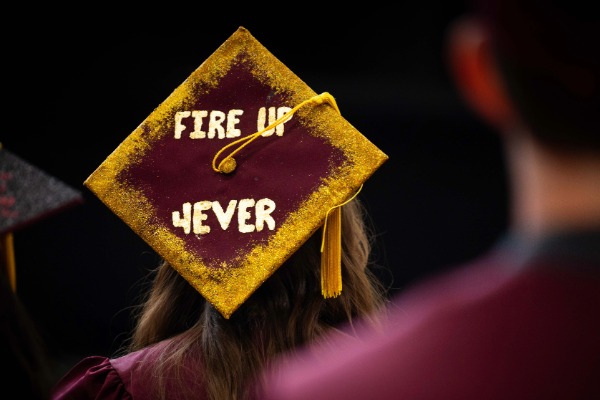 A person wearing a CMU graduation cap.