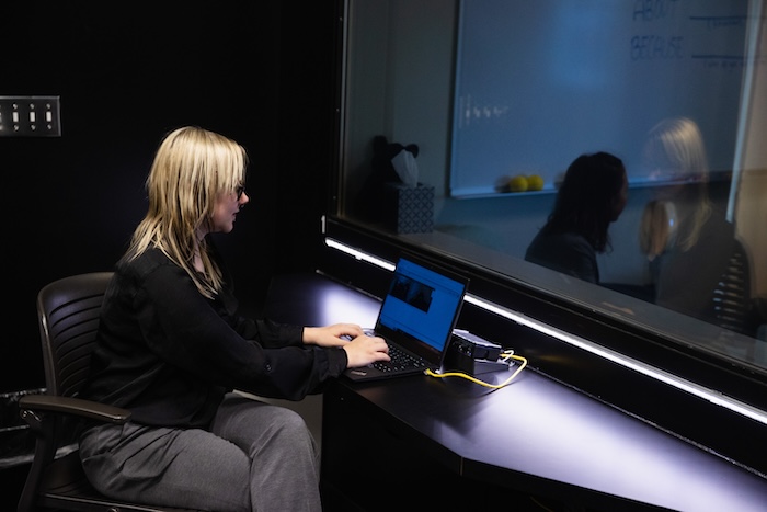 A student in the counseling observation room.