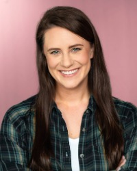 2026-04-10-Callie-Santillana-01-200x250 a headshot of Callie Santillana wearing a green flannel shirt against a pink background.