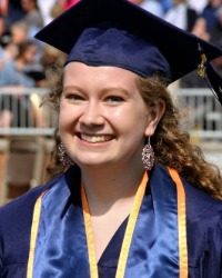 2026-04-10-Kendahl-Miller-01-200x250 Kendahl Miller wearing a blue graduation cap and gown.