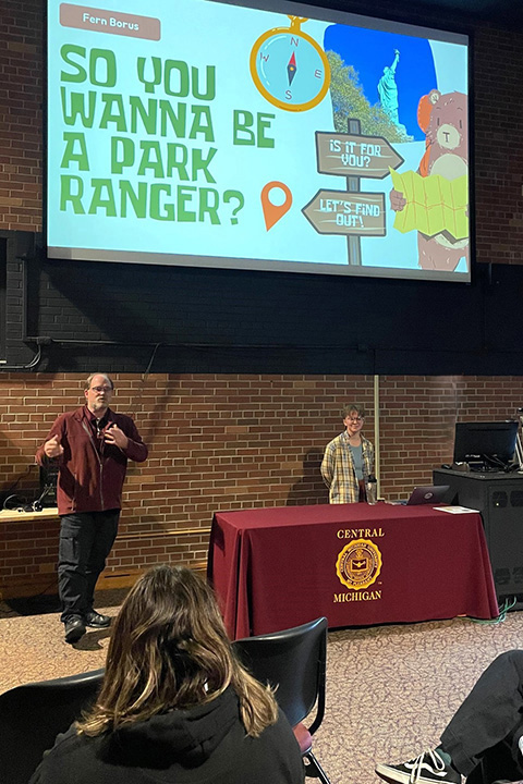 CMU Museum Director Ron Bloomfield stands near CMU alum Fern Borus inside the CMU Museum.