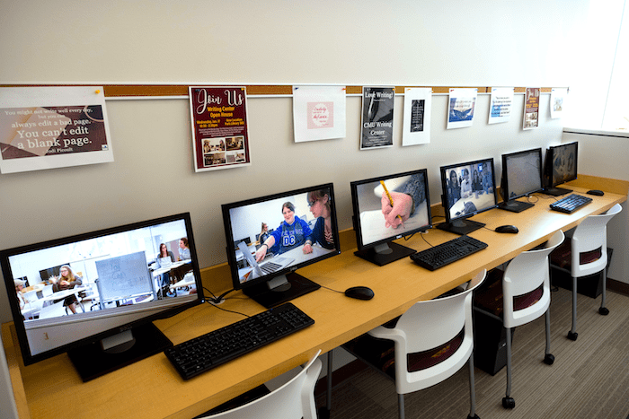 Image of Writing Center computers, tables and chairs.