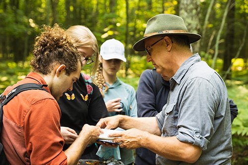 Central Michigan University biology faculty member in the field with students on Beaver Island.