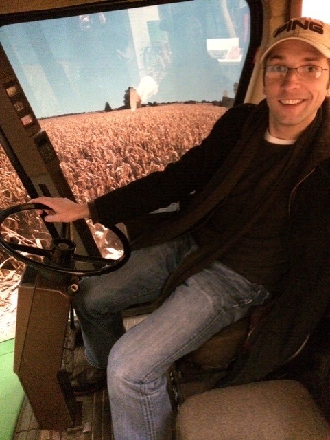 a man driving a tractor