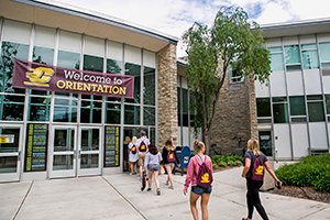 Students walking into UC building for orientation