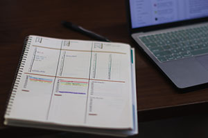 priority consideration blog 2 A notebook with different columns of information.