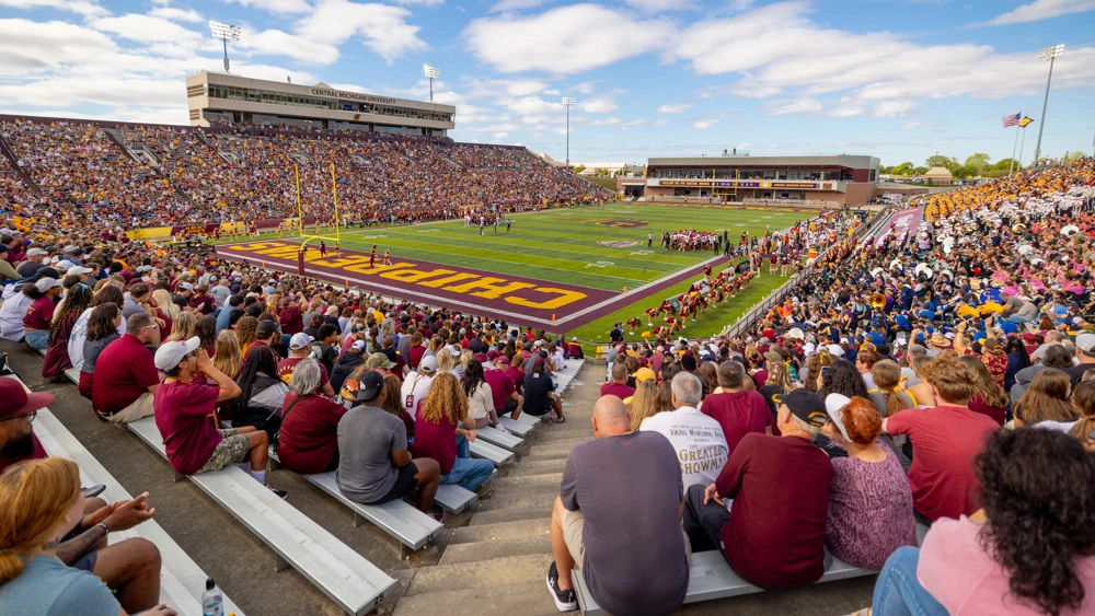 Thousands of people watch the football field in Kelly Shorts Stadium