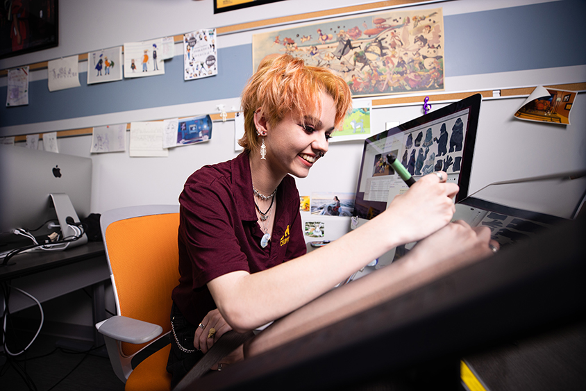 2022-132-0013-Fall Awareness Computer Animation - Shaw as22 Female student drawing animations on a computer screen.