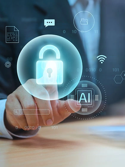 Two circles, one containing the letters AI and another containing a locked padlock, float in the air in front of a background of a man in a suit sitting at a laptop computer.