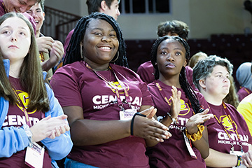 A group of people clapping