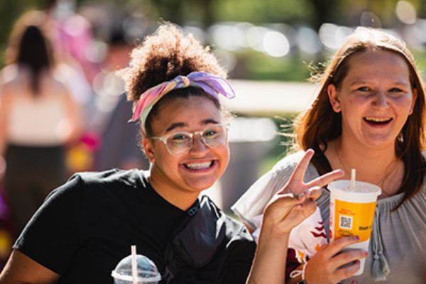 Two Central Michigan University students smile for the camera during Weeks of Welcome.