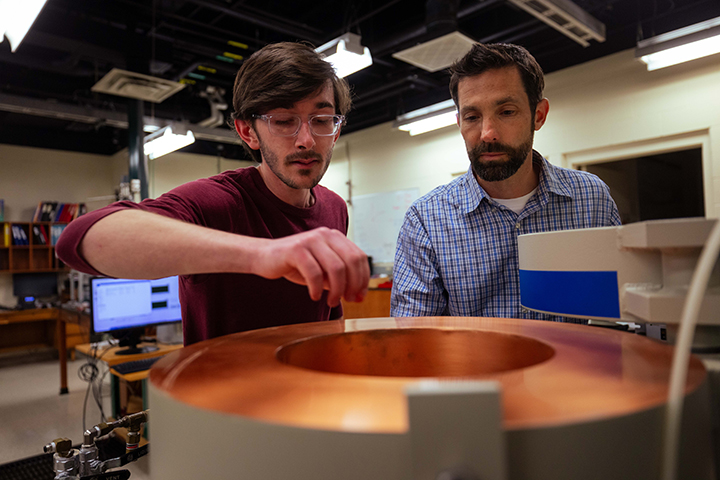 Ryan Opperman and Dr. Matt Redshaw research Using FT-ICR for a Neutron Lifetime Beam Measurement during the McNair Research Institute 2026.