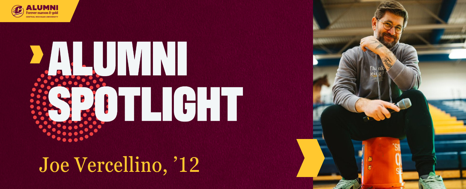 Central Michigan University Alumni Spotlight graphic featuring Joe Vercellino, class of 2012, wearing a grey hoodie and holding a microphone while sitting on an orange bucket in a gymnasium.