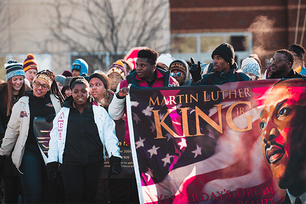 20211123_Student Life_MLK_1_600x400 Central Michigan University students walking in the annual Martin Luther King Jr. march on campus and holding an MLK banner.