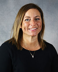 Jennifer Savard A woman wearing a black shirt smiles for a headshot.